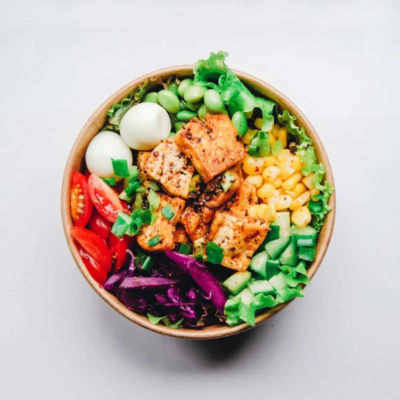Fresh salad bowl with colorful toppings